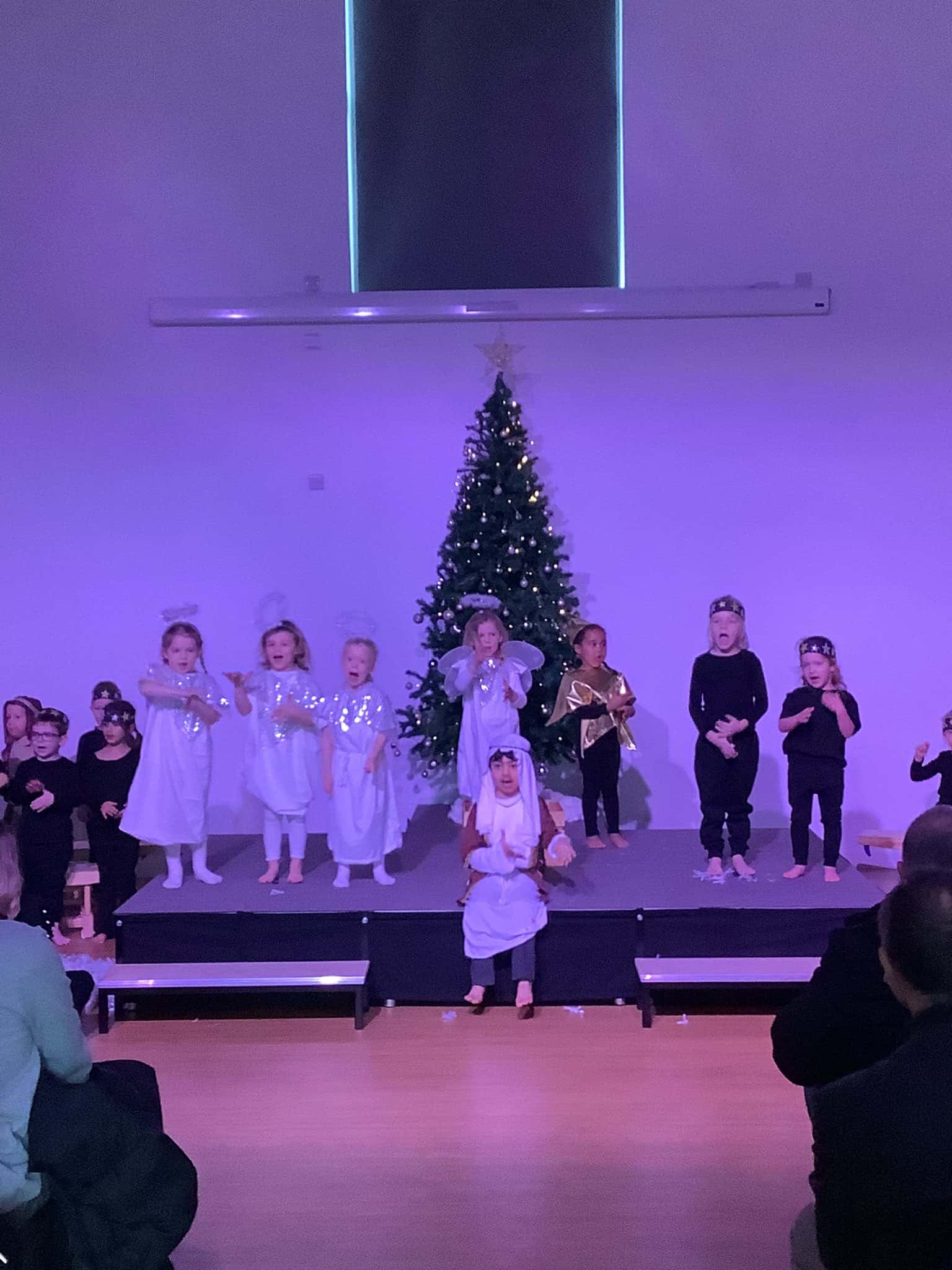 Children in reception perform in their Christmas production