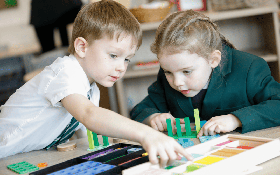 Woodford Primary School pupils working together during maths class using blocks to help them calculate their sums.